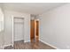 Bedroom with hardwood floors and a view of the backyard at 975 Rolling Hill Rd, Greenwood, IN 46142
