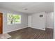 Empty living room with hardwood floors and large windows at 975 Rolling Hill Rd, Greenwood, IN 46142