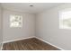 Well-lit bedroom with hardwood floors and neutral walls at 975 Rolling Hill Rd, Greenwood, IN 46142