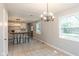 Open dining room with kitchen view and tile floor at 975 Rolling Hill Rd, Greenwood, IN 46142
