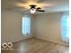 Bright bedroom with hardwood floors and ceiling fan at 10429 Serviceberry Dr, Avon, IN 46123