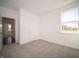 Spacious bedroom featuring a large closet and access to a hallway at 5858 Handbell Ln, Greenwood, IN 46143