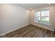 Empty office with hardwood floors and large window at 9227 Brookview Ave, McCordsville, IN 46055