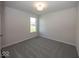 Bright bedroom with carpet flooring and a large window at 9227 Brookview Ave, McCordsville, IN 46055