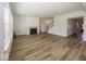 Open living room with hardwood floors, fireplace and access to kitchen at 9227 Brookview Ave, McCordsville, IN 46055