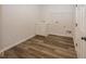 Laundry room with vinyl flooring and white cabinets at 9227 Brookview Ave, McCordsville, IN 46055