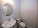 Small bathroom with pedestal sink and toilet at 9227 Brookview Ave, McCordsville, IN 46055