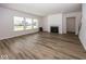 Spacious living room featuring a fireplace and hardwood floors with large windows at 9227 Brookview Ave, McCordsville, IN 46055