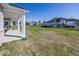 Large backyard with grassy area and homes in the background at 9227 Brookview Ave, McCordsville, IN 46055
