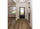 Bright entryway with dark hardwood floors at 9227 Brookview Ave, McCordsville, IN 46055