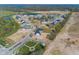 Aerial view of a new residential community with houses, ponds, and open space at 9227 Brookview Ave, McCordsville, IN 46055