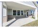 Covered patio with brick and concrete flooring at 9227 Brookview Ave, McCordsville, IN 46055