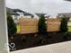 Modern wood privacy screen and landscaping in front yard at 9227 Brookview Ave, McCordsville, IN 46055