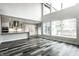 Modern kitchen with white cabinets and island open to the living area at 441 W 86Th St, Indianapolis, IN 46260
