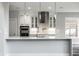 Modern white kitchen with stainless steel appliances and quartz countertops at 441 W 86Th St, Indianapolis, IN 46260