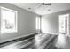 Bright bedroom with two windows, hardwood floors, and access to a closet at 441 W 86Th St, Indianapolis, IN 46260