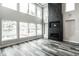 Spacious living room with large windows, fireplace, and hardwood floors at 441 W 86Th St, Indianapolis, IN 46260