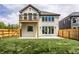 Modern two-story house with a light gray exterior, deck, and fenced backyard at 441 W 86Th St, Indianapolis, IN 46260