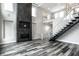 Modern living room with high ceilings, fireplace, and hardwood floors at 441 W 86Th St, Indianapolis, IN 46260