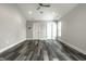 Large bedroom with wood-look floors and two windows at 441 W 86Th St, Indianapolis, IN 46260