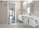 Double vanity bathroom with modern finishes and a view to another room at 441 W 86Th St, Indianapolis, IN 46260