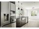 Modern kitchen with stainless steel appliances and a large island at 437 W 86Th St, Indianapolis, IN 46260