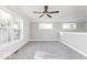 Large bedroom with carpet, ceiling fan and large windows at 437 W 86Th St, Indianapolis, IN 46260