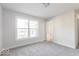 Simple bedroom with large window and carpet at 437 W 86Th St, Indianapolis, IN 46260
