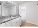 Bathroom with granite countertop and white cabinets at 437 W 86Th St, Indianapolis, IN 46260