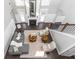 Open living room with hardwood floors, high ceilings, and a fireplace at 437 W 86Th St, Indianapolis, IN 46260