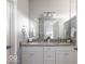 Double vanity bathroom with granite countertops and white cabinets at 437 W 86Th St, Indianapolis, IN 46260