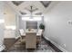 Formal dining room with a rustic wood table and neutral color palette at 437 W 86Th St, Indianapolis, IN 46260