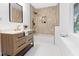 Modern bathroom with a walk-in shower, new vanity, and hexagon tile floor at 3031 N New Jersey St, Indianapolis, IN 46205