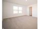 Well-lit bedroom featuring a large window and door to bathroom at 1550 Hanover St, Danville, IN 46122