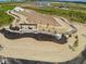 Aerial view of community entrance, featuring a stone sign and winding path at 1550 Hanover St, Danville, IN 46122