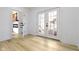 Bright hallway with hardwood floors and french doors leading outside at 2936 N New Jersey St, Indianapolis, IN 46205