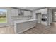 Modern kitchen with white cabinets, quartz countertops and stainless steel appliances at 4953 Carmine Ct, Brownsburg, IN 46112