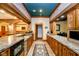 Basement bar with granite countertop and ample cabinet space at 8358 Hidden Point Dr, Indianapolis, IN 46256