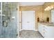 Elegant bathroom featuring a large shower, granite countertop vanity, and tile floors at 8358 Hidden Point Dr, Indianapolis, IN 46256