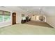 Spacious bonus room with a large carpeted area and plenty of natural light at 8358 Hidden Point Dr, Indianapolis, IN 46256