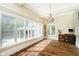 Breakfast area with large windows overlooking the pool and backyard at 8358 Hidden Point Dr, Indianapolis, IN 46256