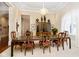 Formal dining room with a large table, chandelier, and hardwood floors at 8358 Hidden Point Dr, Indianapolis, IN 46256
