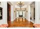 Elegant entryway with hardwood floors, high ceilings, and a chandelier at 8358 Hidden Point Dr, Indianapolis, IN 46256