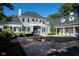 Stunning two-story home with a gray exterior, black shutters, and a large driveway at 8358 Hidden Point Dr, Indianapolis, IN 46256