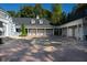 Spacious three-car garage with covered parking and brick pavers at 8358 Hidden Point Dr, Indianapolis, IN 46256