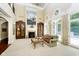 Spacious Gathering room with a fireplace, large windows, and a view of the pool at 8358 Hidden Point Dr, Indianapolis, IN 46256