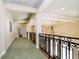 Grand hallway with high ceilings, ornate railing, and a large vase at 8358 Hidden Point Dr, Indianapolis, IN 46256