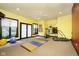 Fitness room with various workout equipment and large windows at 8358 Hidden Point Dr, Indianapolis, IN 46256