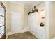 Convenient mudroom with built-in storage and tile flooring at 8358 Hidden Point Dr, Indianapolis, IN 46256