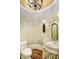 Stylish powder room with a pedestal sink and floral wall accents at 8358 Hidden Point Dr, Indianapolis, IN 46256